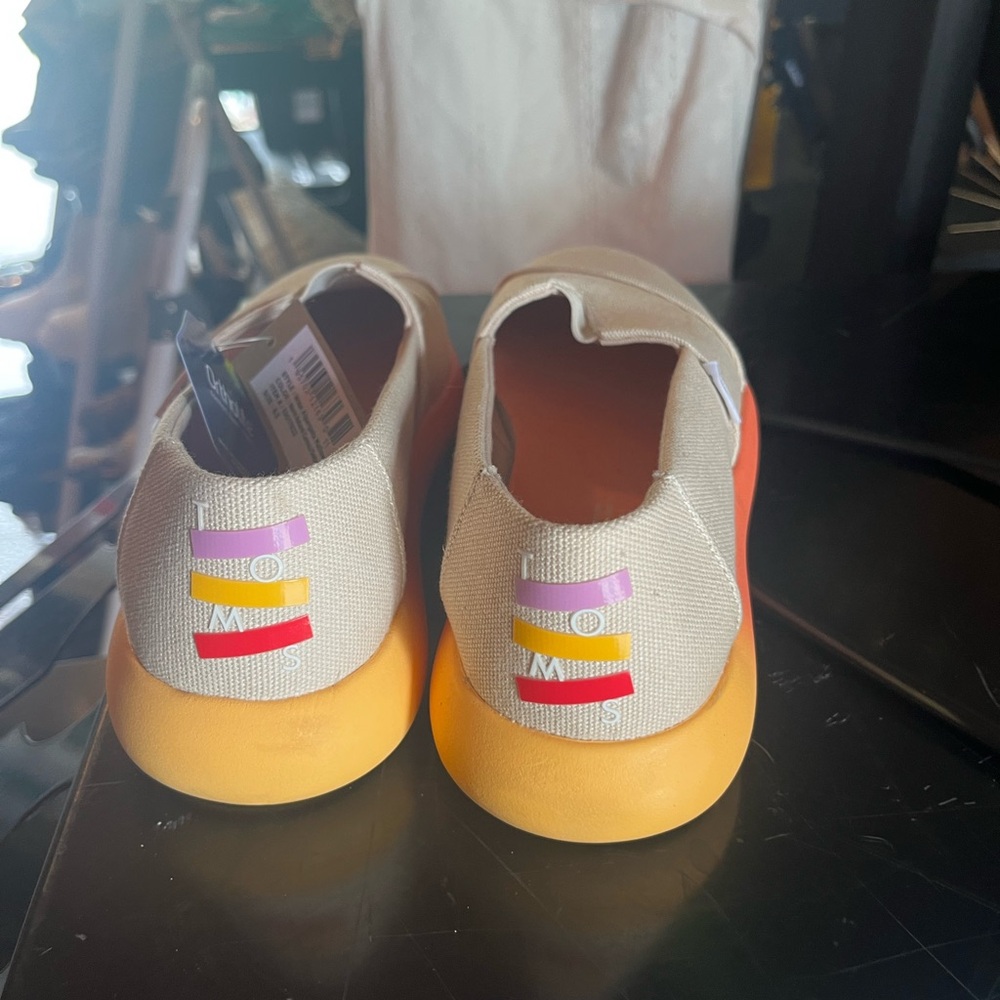 Vibrant Orange and Yellow Tom’s with Colorful Heel